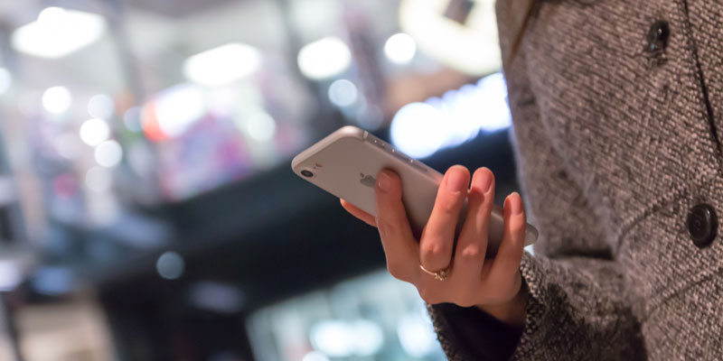 close-up of woman's hand holding iphone 