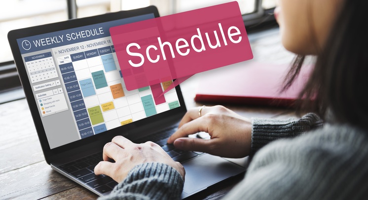 small business owner scheduling social media posts using a social media management dashboard
