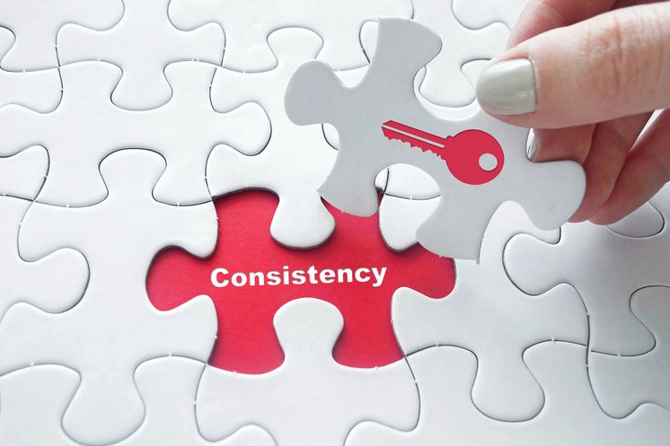puzzle showing consistency is key to marketing success