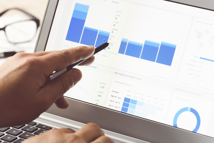pointing to marketing results on computer